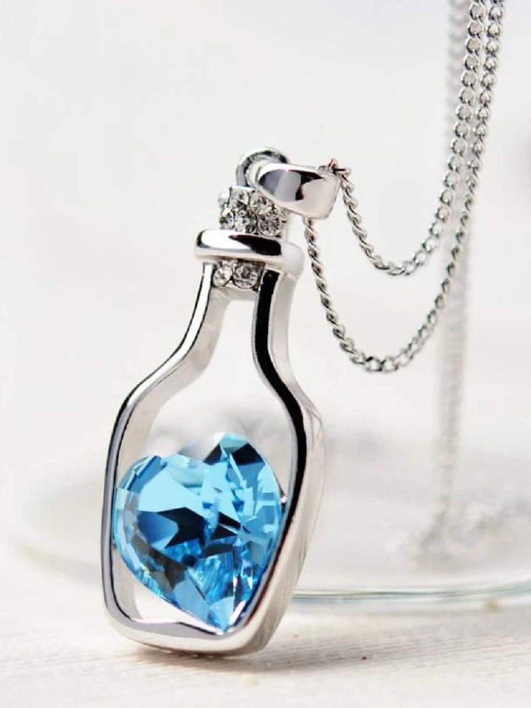 

VAGHBHATT Silver Plated Crystal Studded Heart Bottle Pendant With Chain