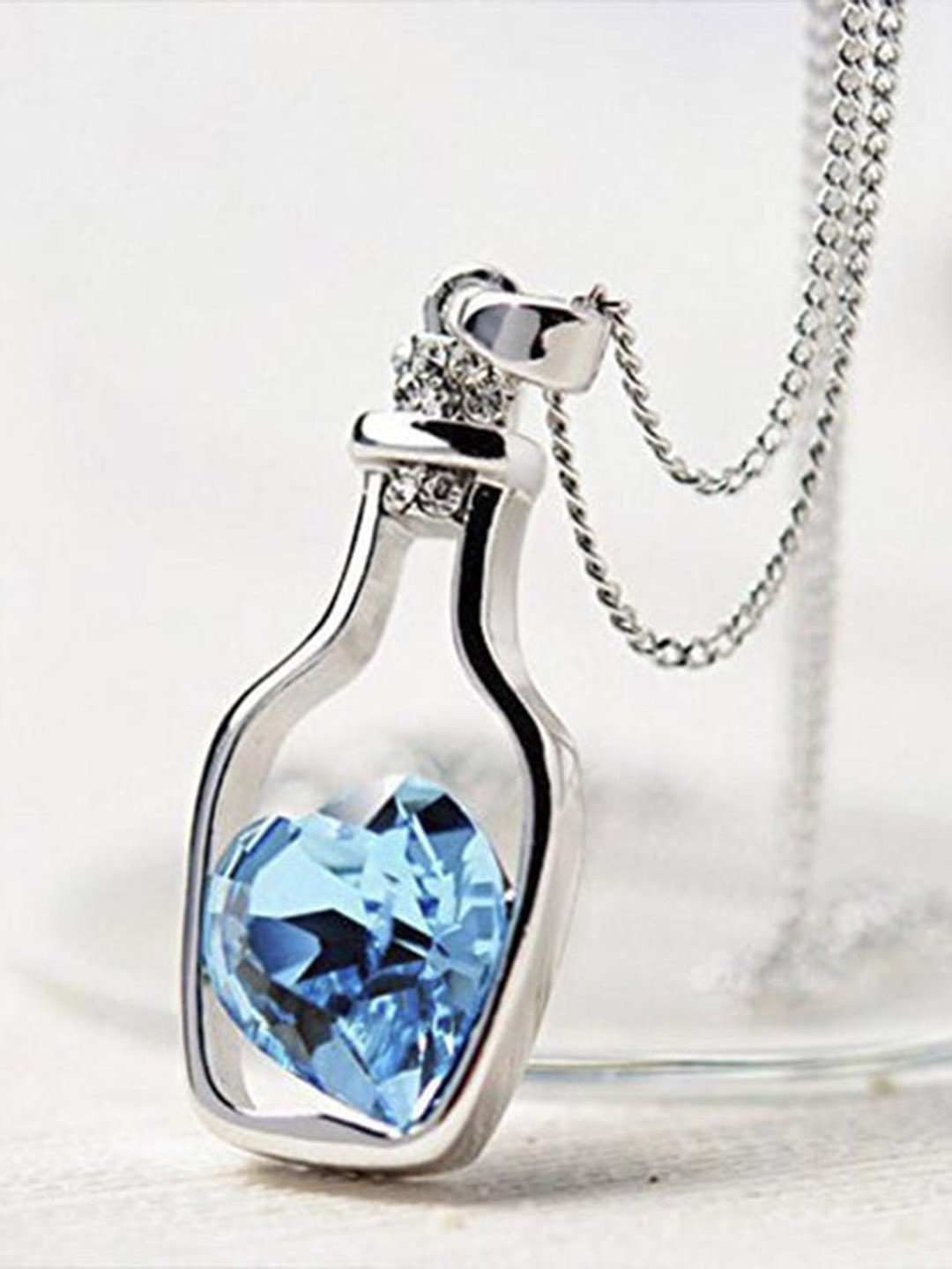 

VAGHBHATT Silver Plated Crystal Studded Heart Bottle Pendant Chain