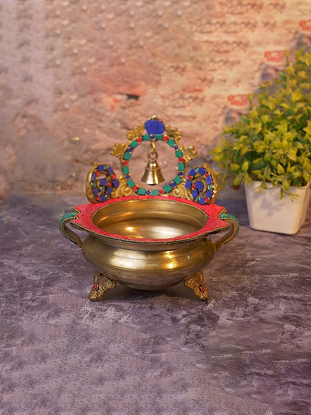 

Two Moustaches Gold-Toned Brass Urli Bowl Showpiece With Bell