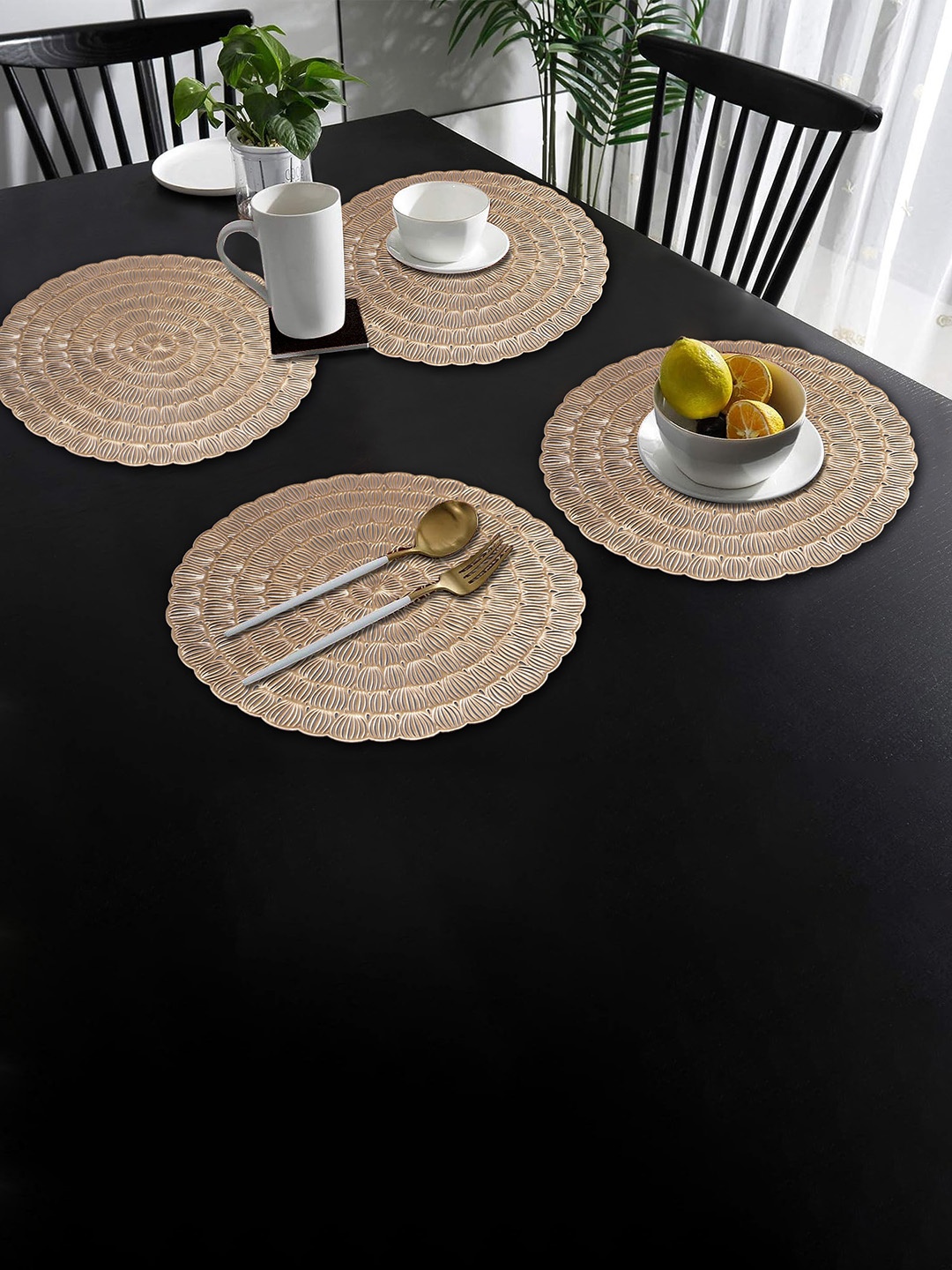 

Dakshya Industries Gold Toned 4 Pieces Textured Round Table Placemats