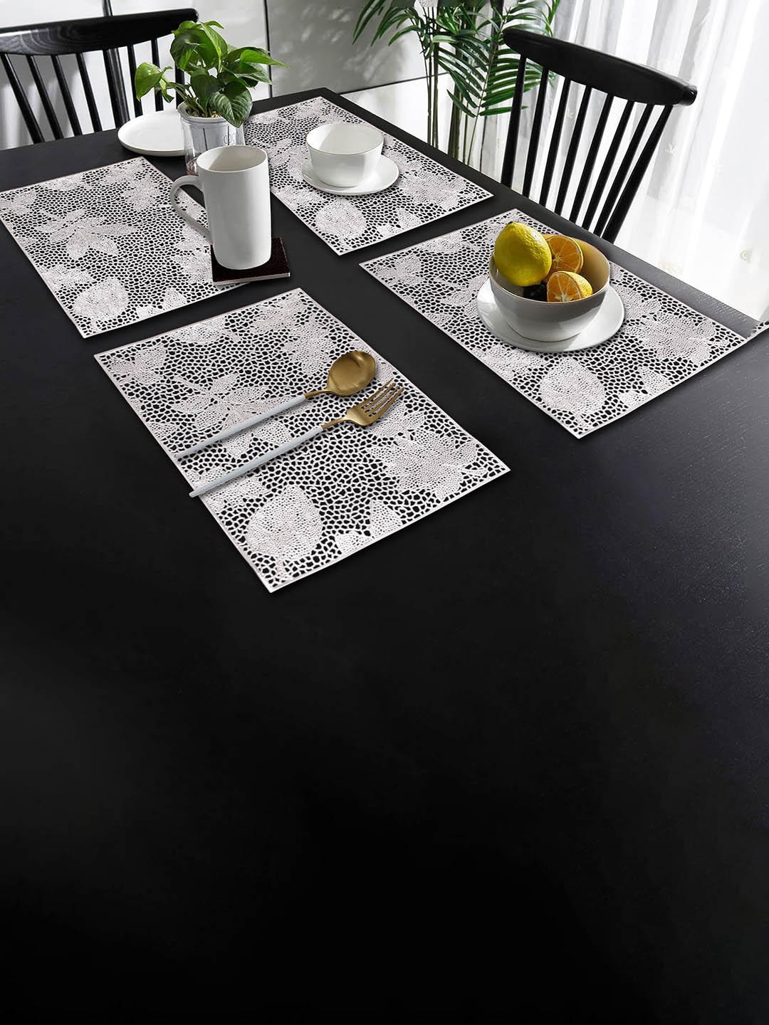 

Dakshya Industries Silver Toned 4 Pieces Floral Rectangle Table Placemats