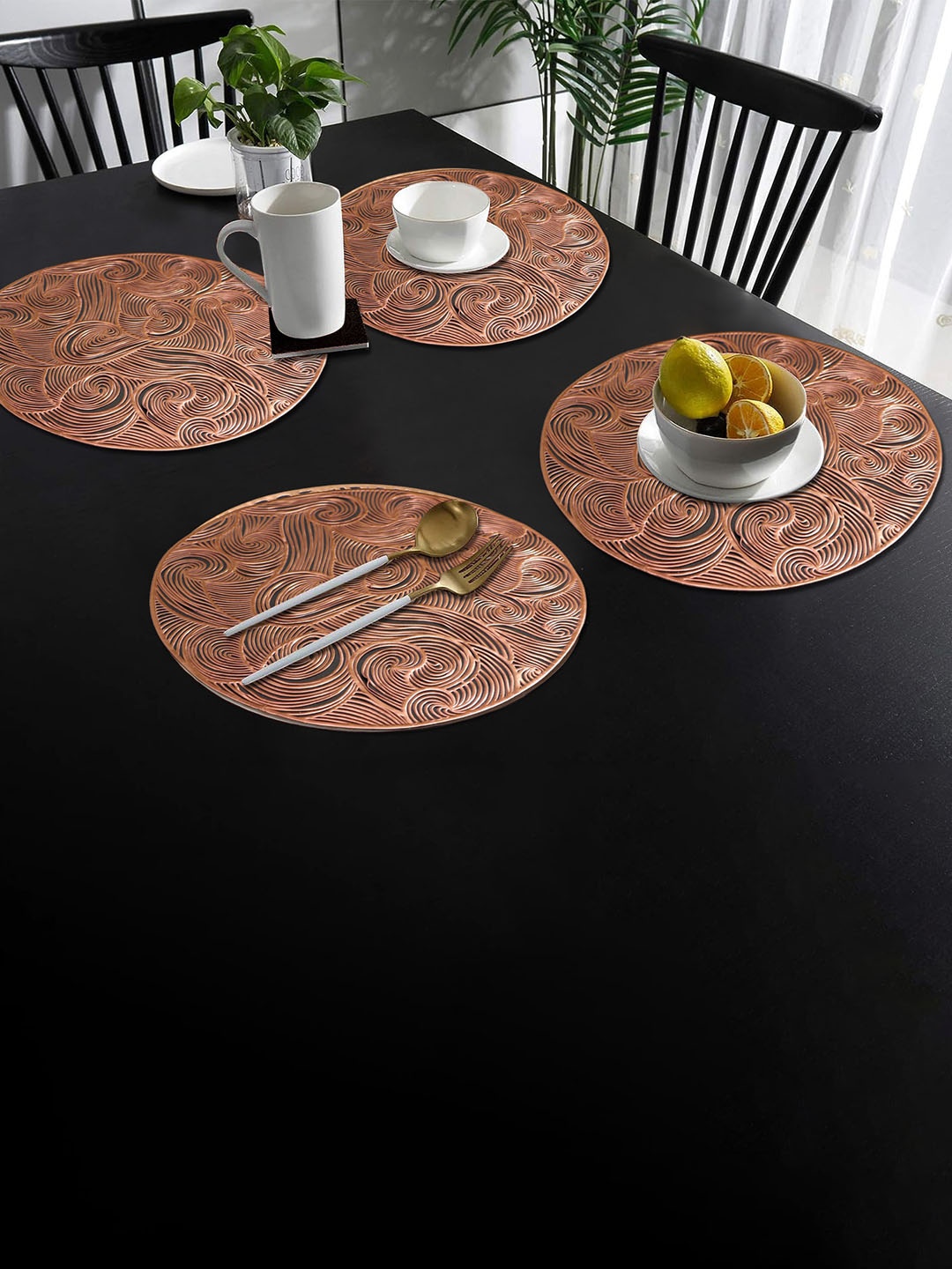 

Dakshya Industries 4- Pcs Copper-Toned Self Design Round Table Placemats