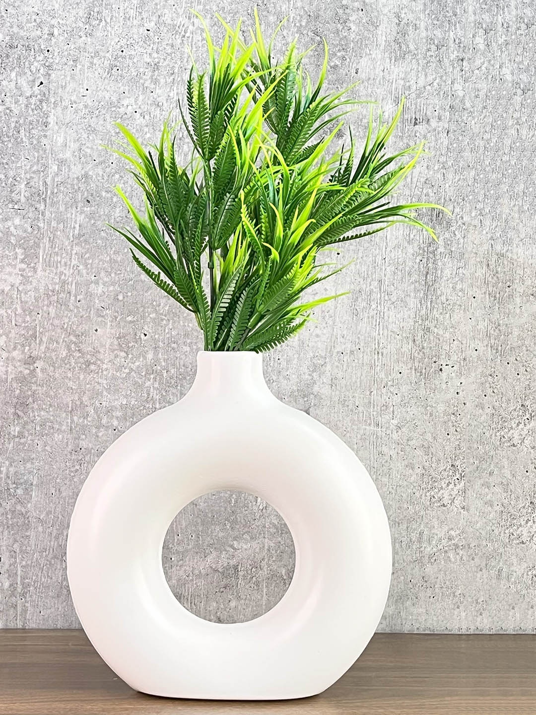 

Akaar Green Artificial Fern Plant with White Donut Pot