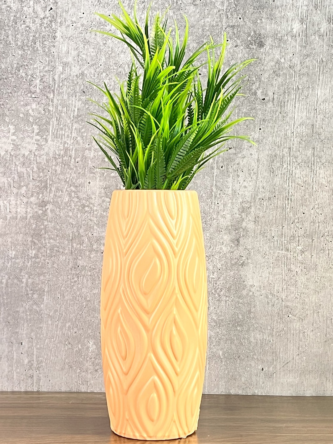 

Akaar Green Artificial Fern Plant with Orange Long Cylindrical Pot