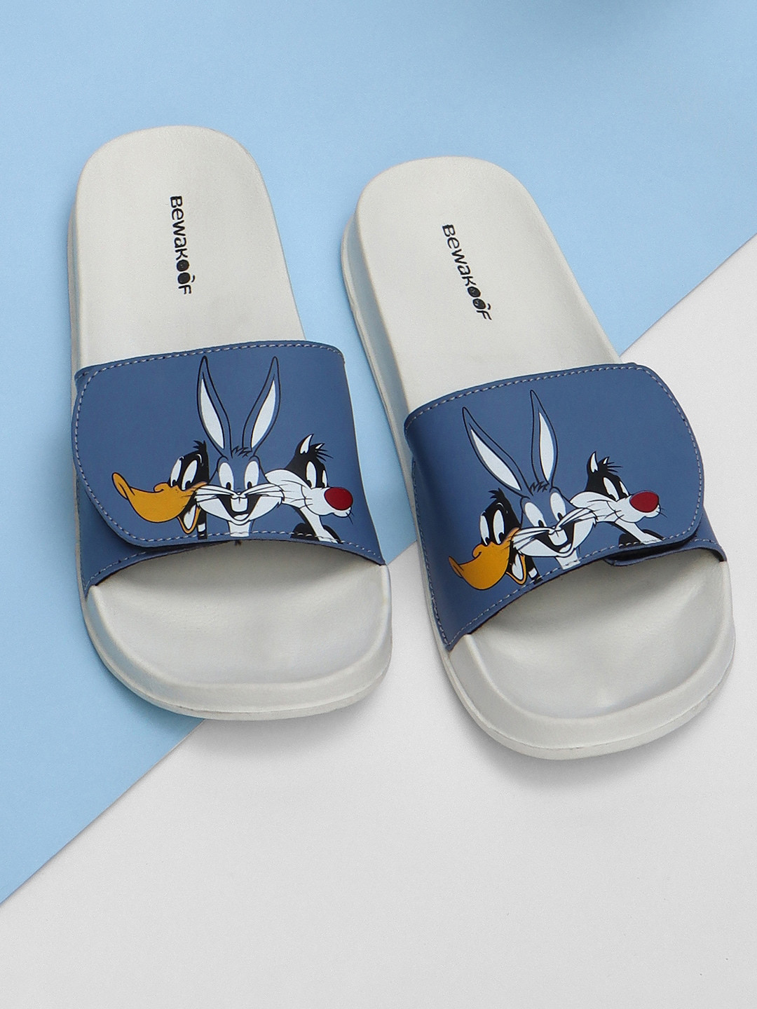 

Bewakoof Women Official Looney Tunes Merchandise X Looney Trio Printed Sliders, Blue