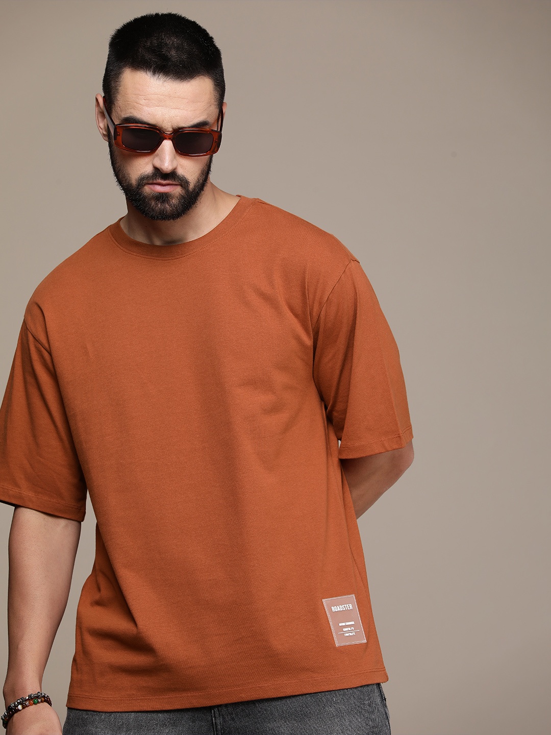 

The Roadster Lifestyle Co. Oversized Fit Pure Cotton Solid Drop-Shoulder Sleeves Casual T-shirt, Brown