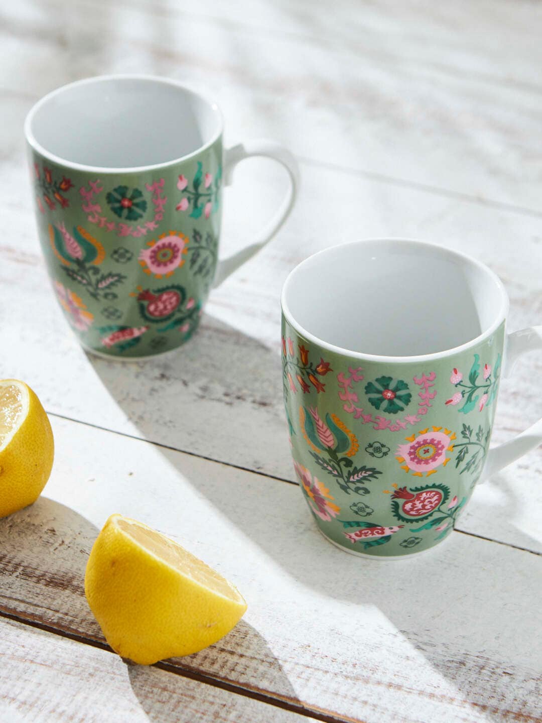 

Chumbak Teal & Pink 2 Pieces Floral Printed Ceramic Glossy Mugs 1.44 L each