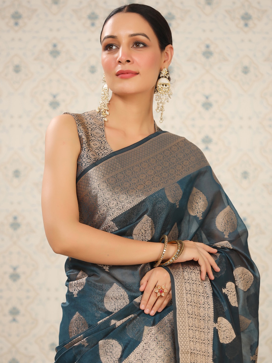 

Ode by House of Pataudi Teal Ethnic Motifs Woven Design Zari Silk Cotton Saree