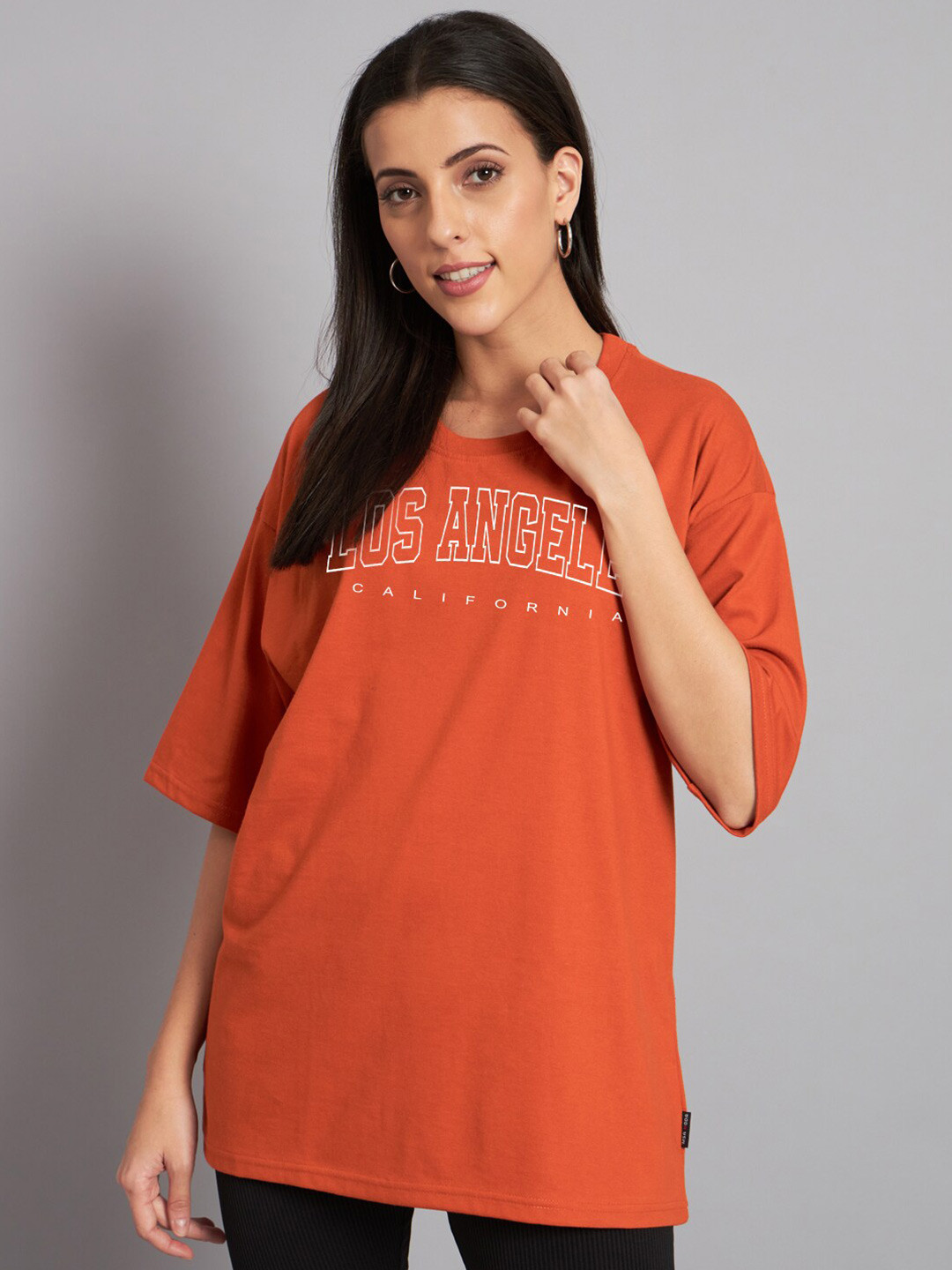 

Imsa Moda Typography Printed Drop-Shoulder Sleeves Cotton Oversized T-shirt, Orange