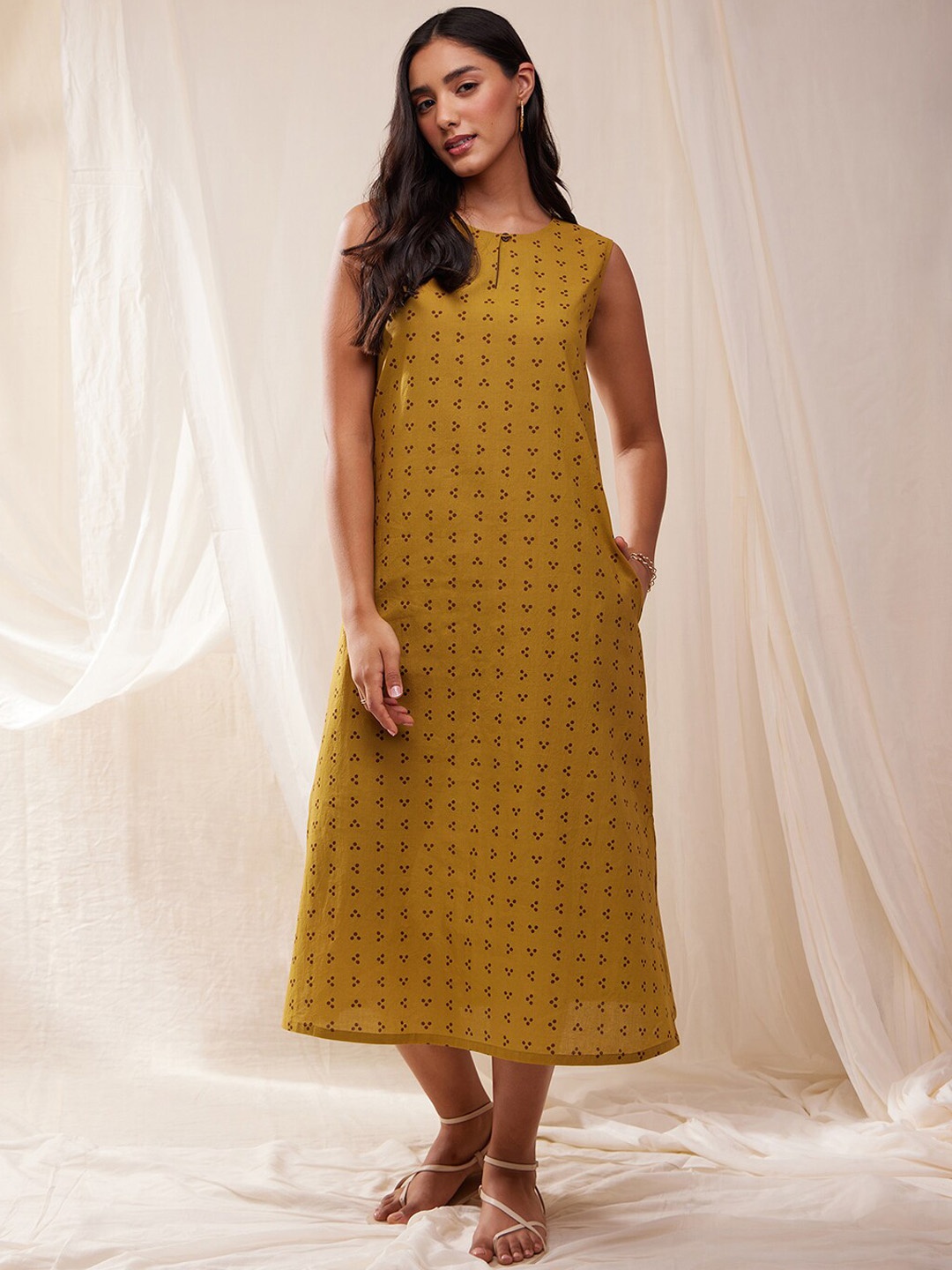 

Pink Fort Ethnic Motifs Printed Sleeveless Cotton A-line Midi Ethnic Dress, Mustard