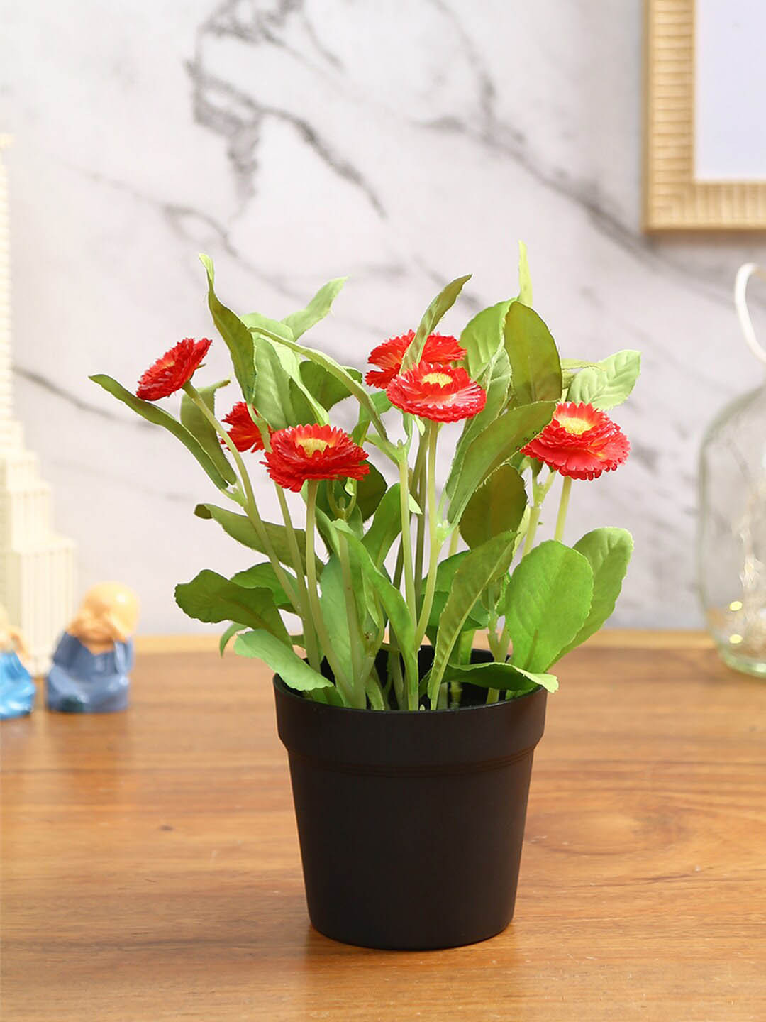 

Fourwalls Orange-color & Black Artificial Daisy Flower Plant With Pot