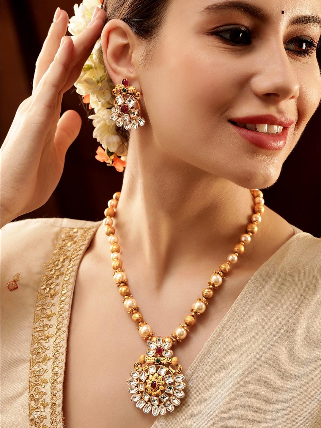 

Rubans 22K Gold Plated White, Emerald & Ruby Kundan Studded with Pearl Beaded Jewellery Set