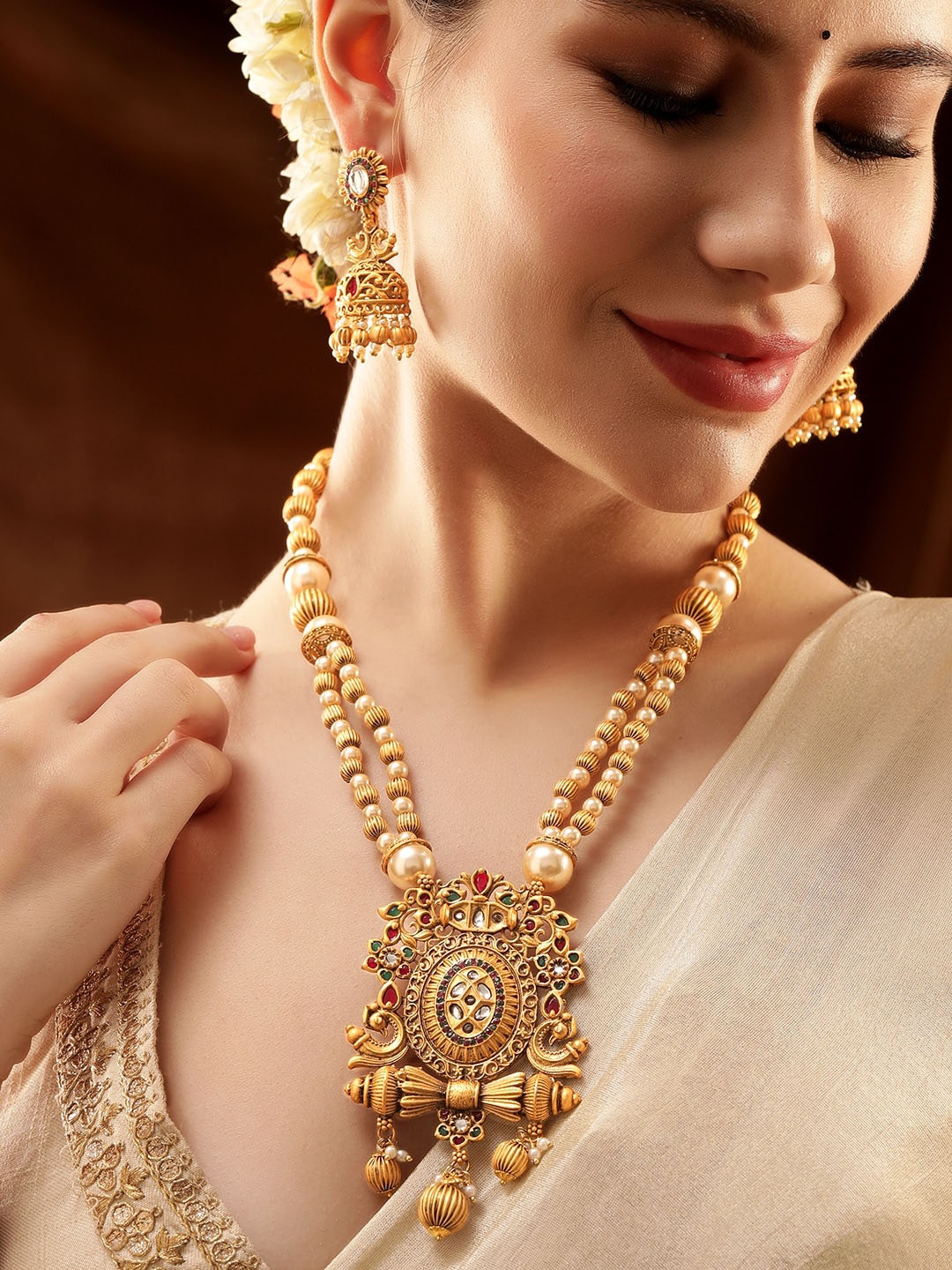 

Rubans 22K Gold Plated Ruby,Emerald Kundan Studded Pearl & Gold Beaded Jewellery Set