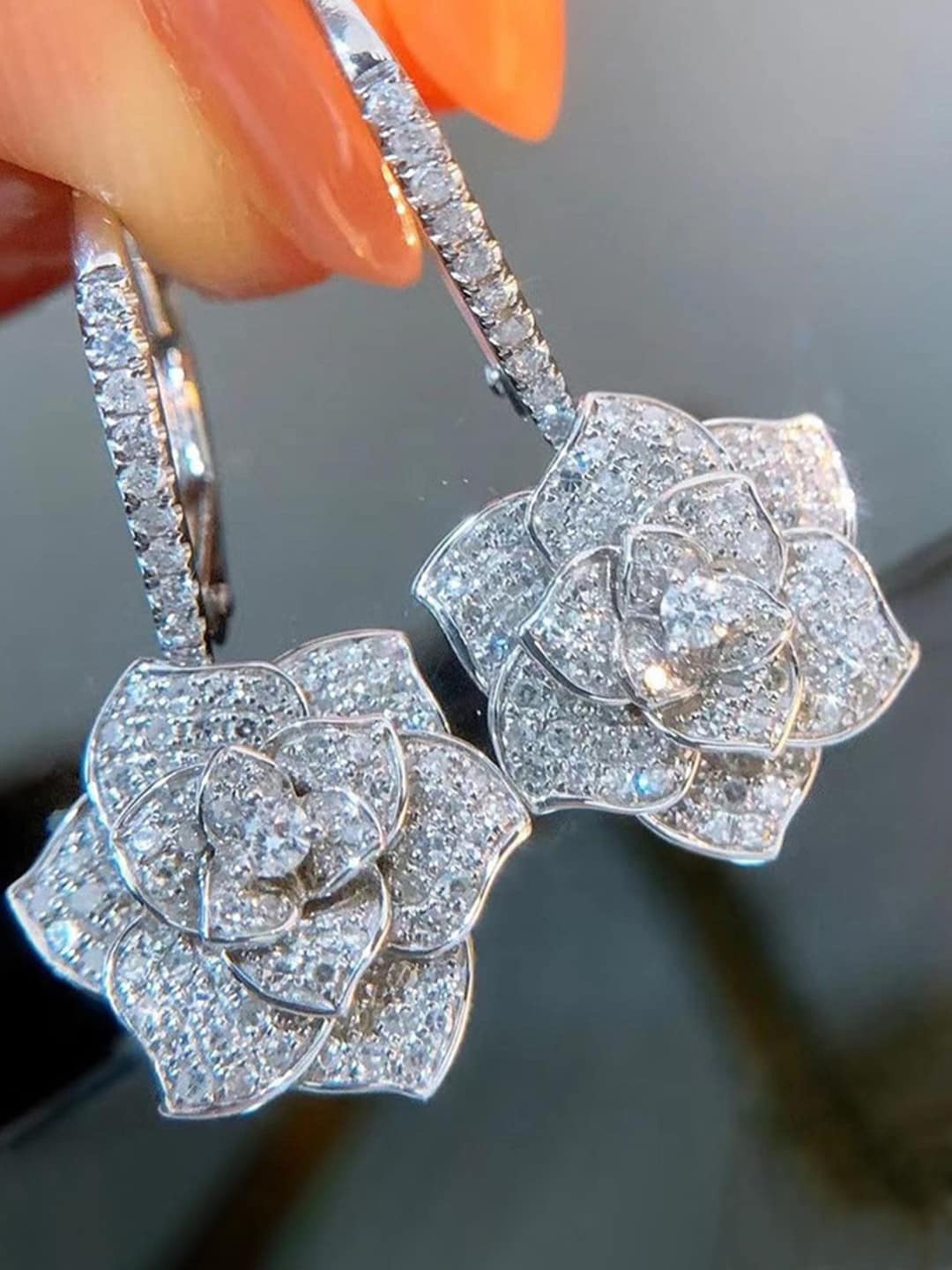 

Designs & You Silver Plated American Diamond Studded Floral Drop Earrings