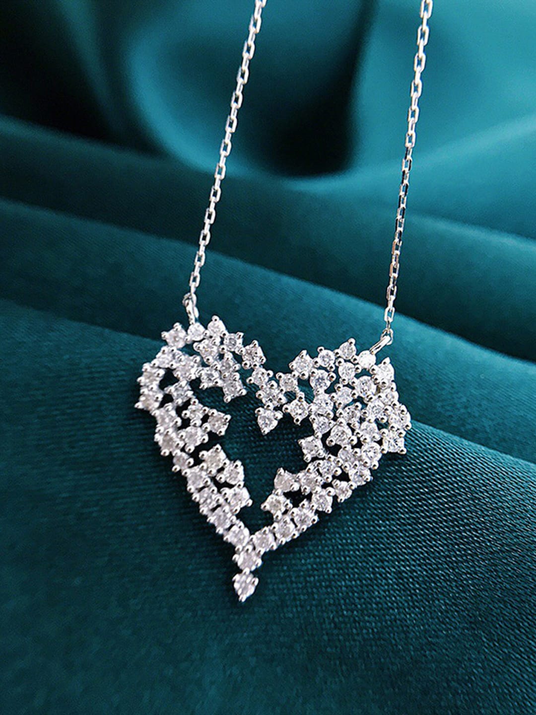 

Designs & You Silver-Plated American Diamond Studded Heart Shape Pendant