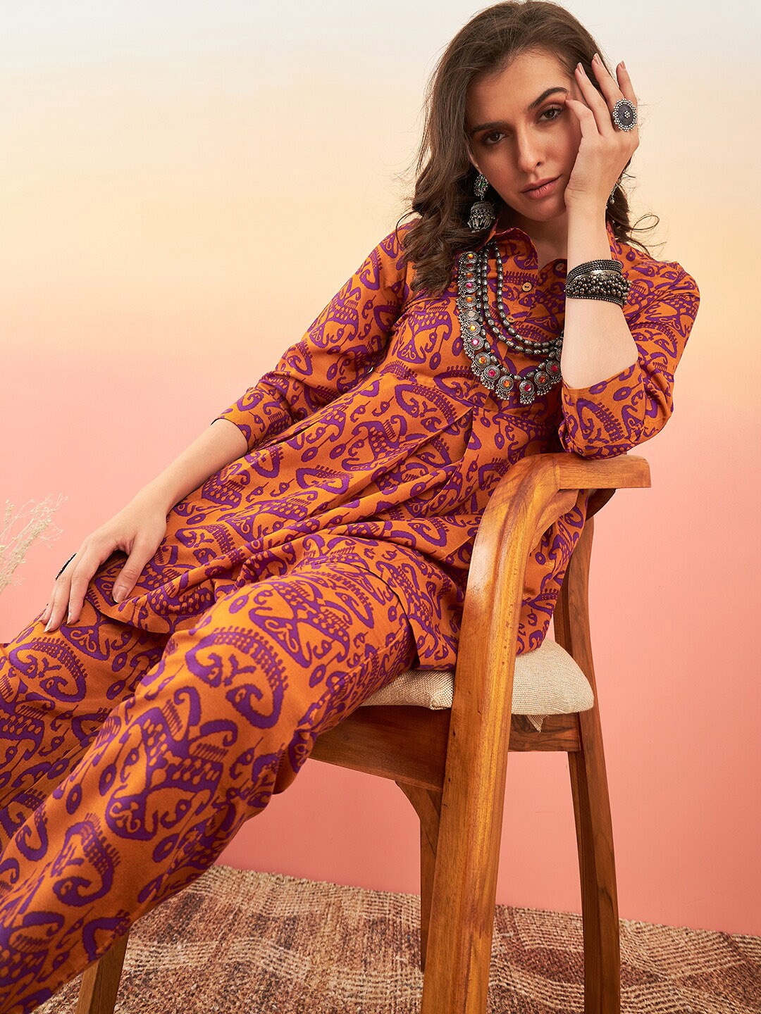 

Sangria Mustard Orange & Purple Ethnic Motifs Printed A-Line Kurti With Trouser