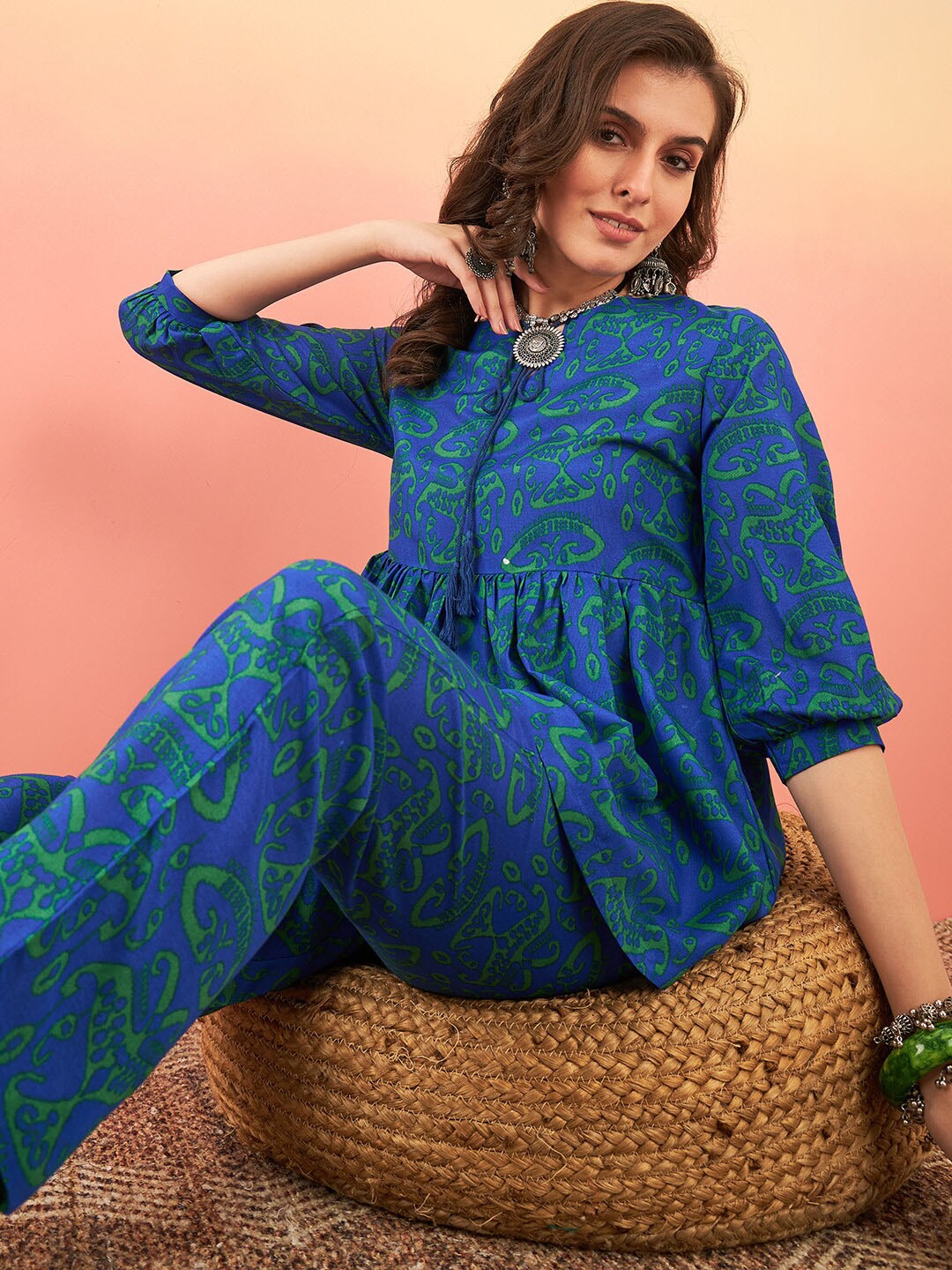 

Sangria Ethnic Motifs Printed Tie-Up Neck Puffed Sleeves A-Line Kurti With Trouser, Blue