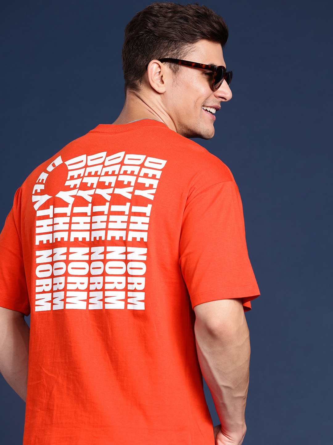 

Mast & Harbour Men Typography Back Print Drop-Shoulder Sleeves Relaxed Fit Knitted T-shirt, Orange