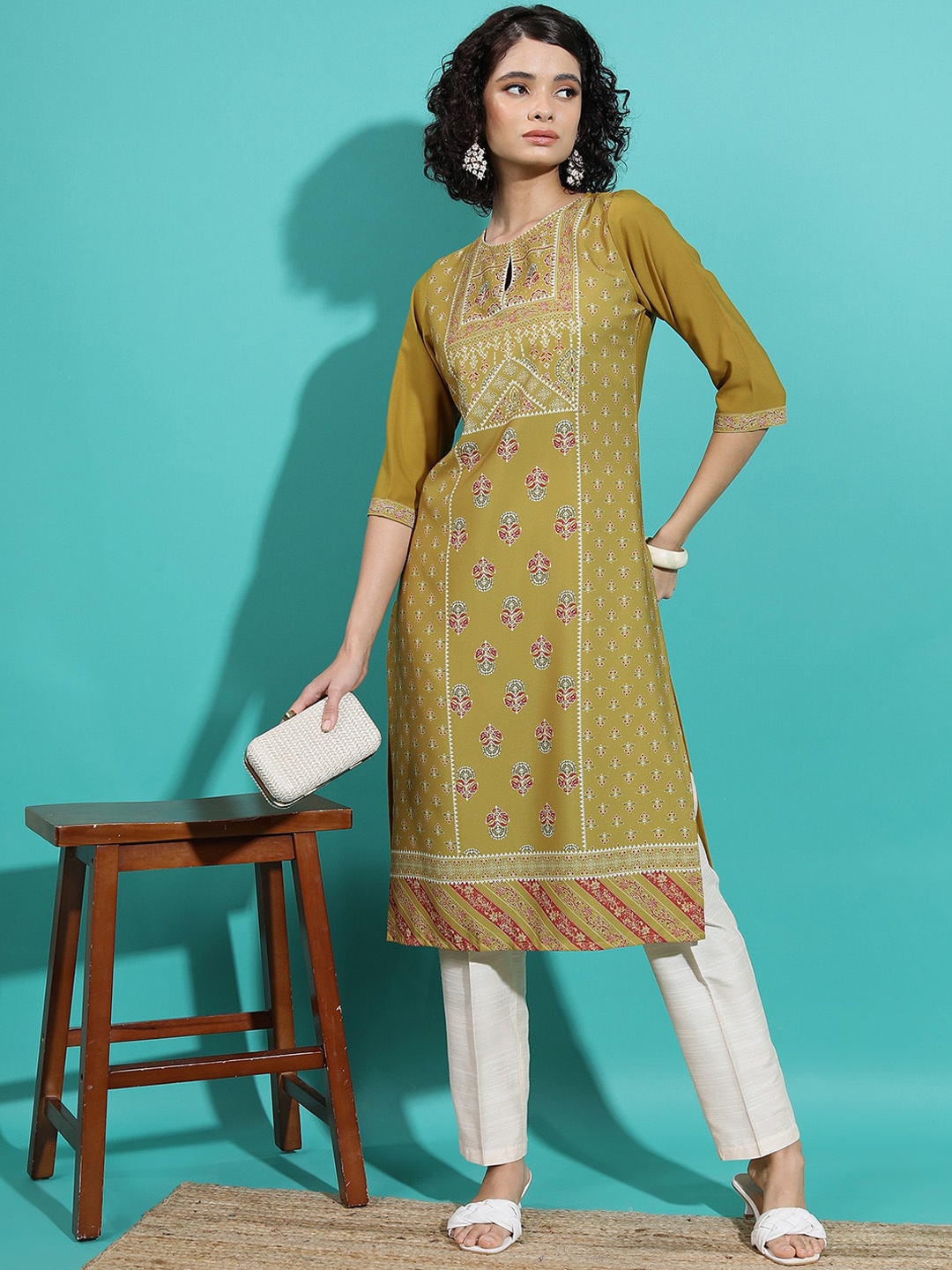 

Vishudh Mustard Yellow Ethnic Motif Printed Keyhole Neck Straight Kurta