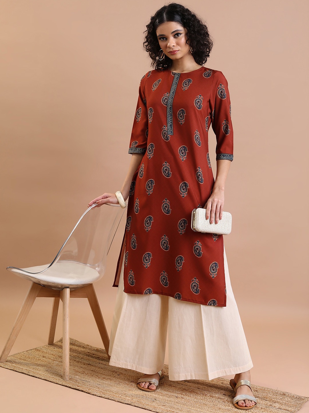 

Vishudh Ethnic Motifs Embellished Keyhole Neck Flared Sleeves Thread Work Kurta, Rust