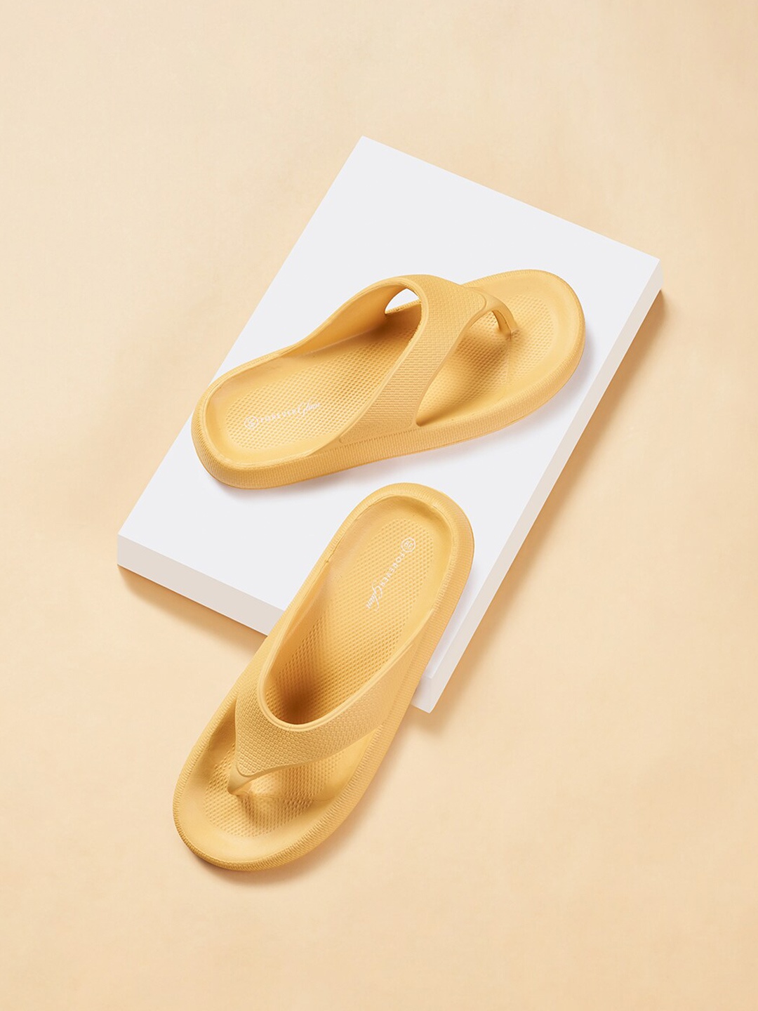 

Forever Glam by Pantaloons Women Textured Rubber Sliders, Mustard