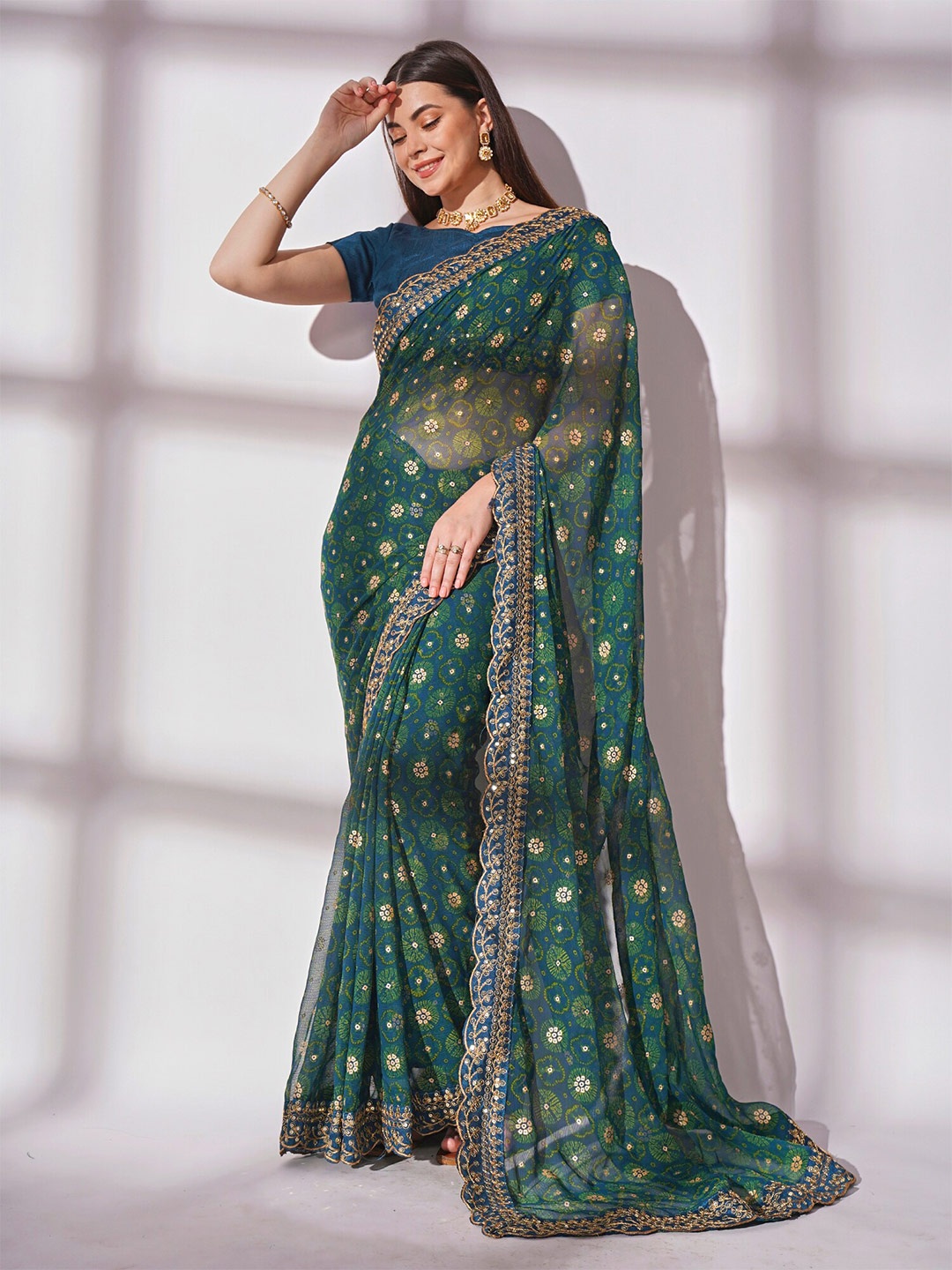 

Mitera Teal Blue & Green Bandhani Printed Sequiend Pure Georgette Saree