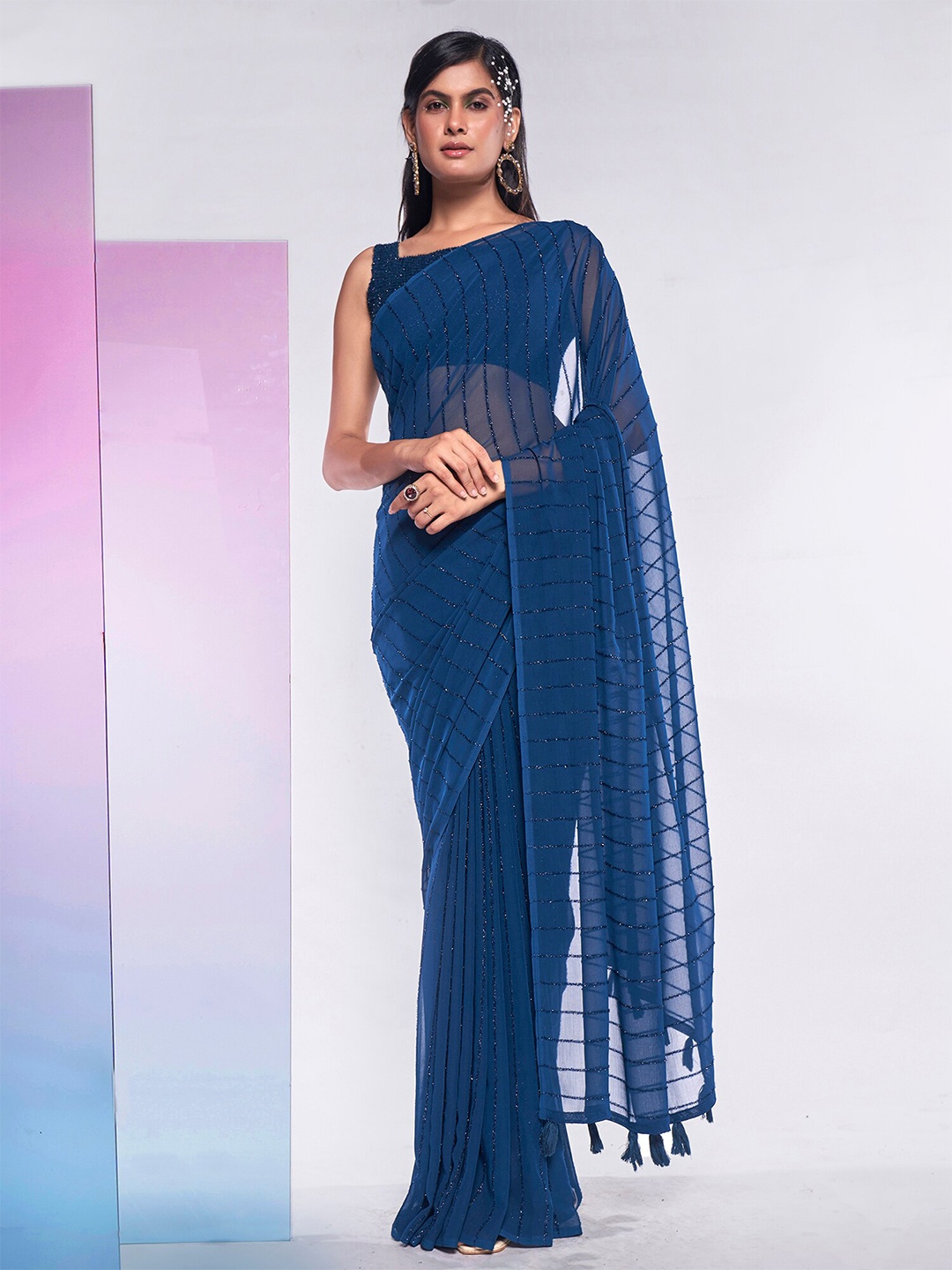 

Mitera Teal Striped Tasseled Pure Georgette Saree