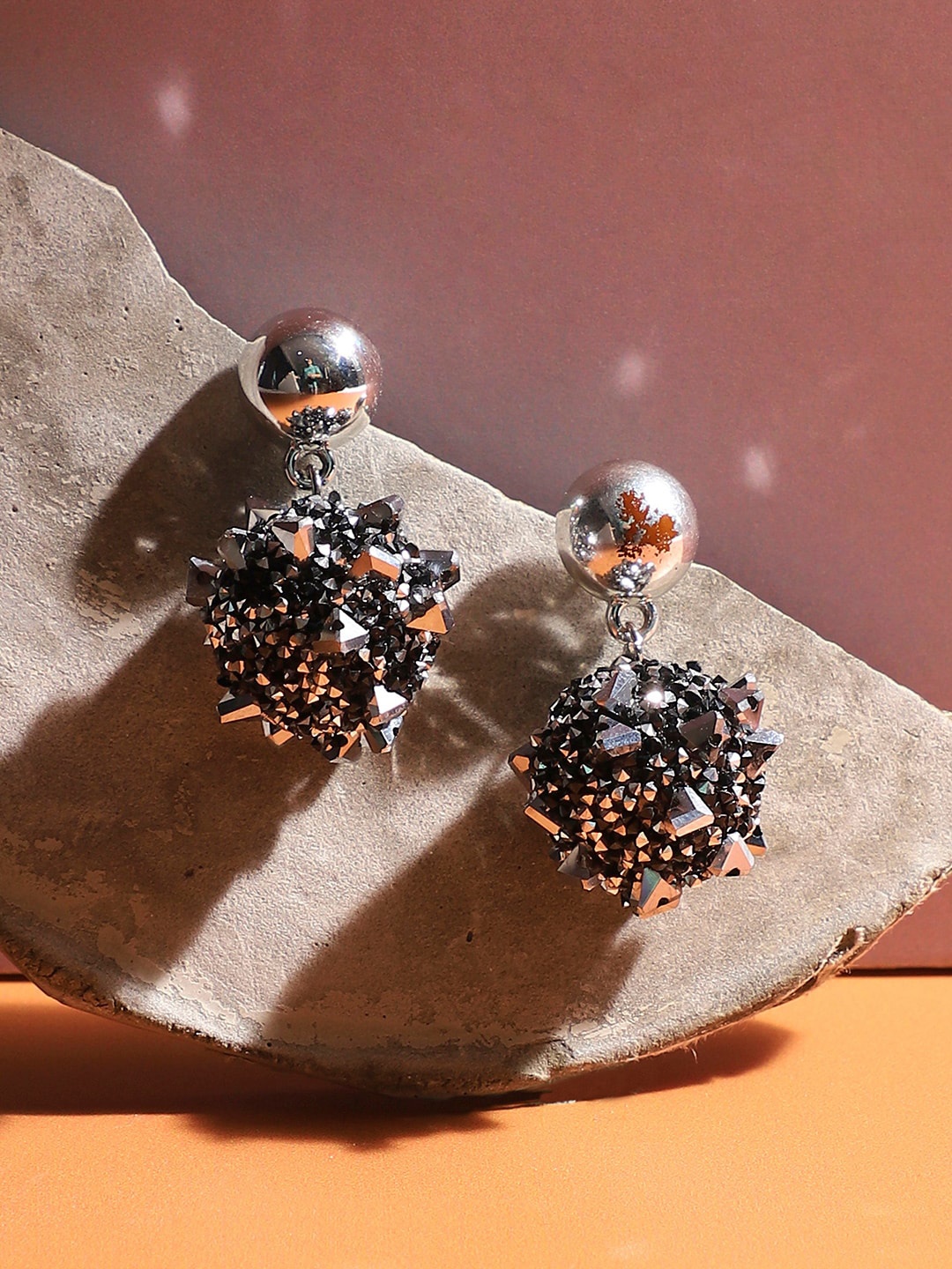 

SOHI Silver-Plated Contemporary Drop Earrings
