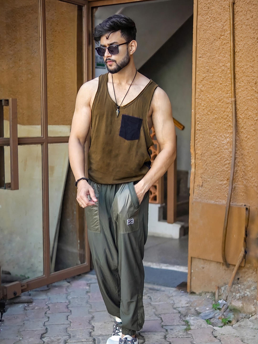 

Roadster Time Travlr Men Olive Green Sleveless Pure Cotton T-shirt with Raw Edges