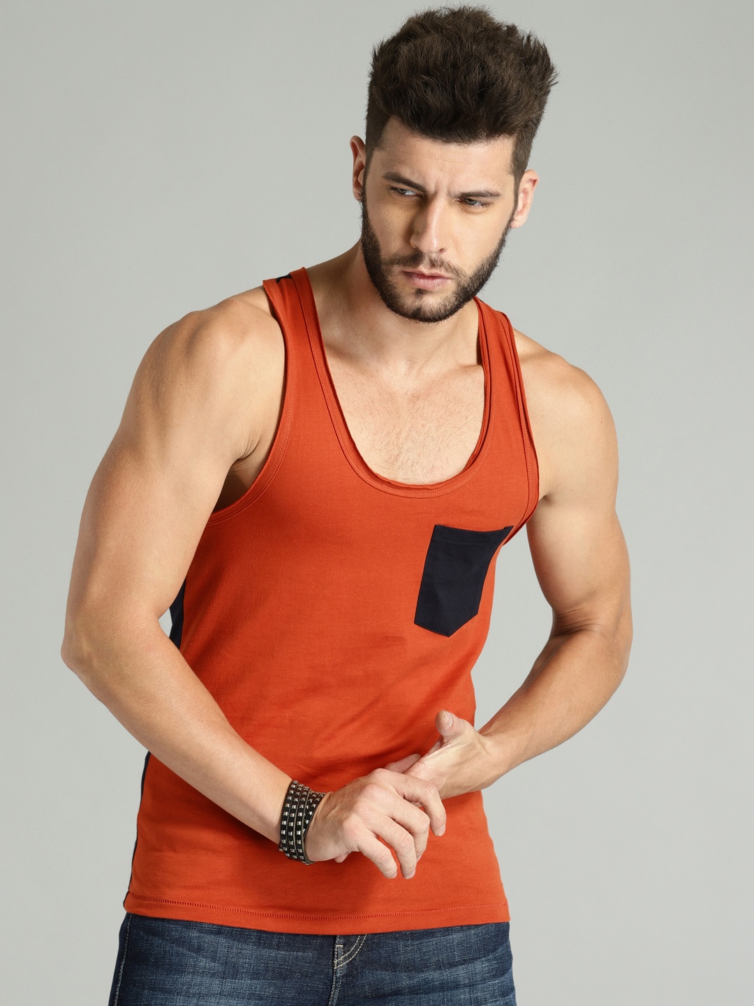 

Roadster Time Travlr Men Rust Orange Sleveless T-shirt with Raw Edges