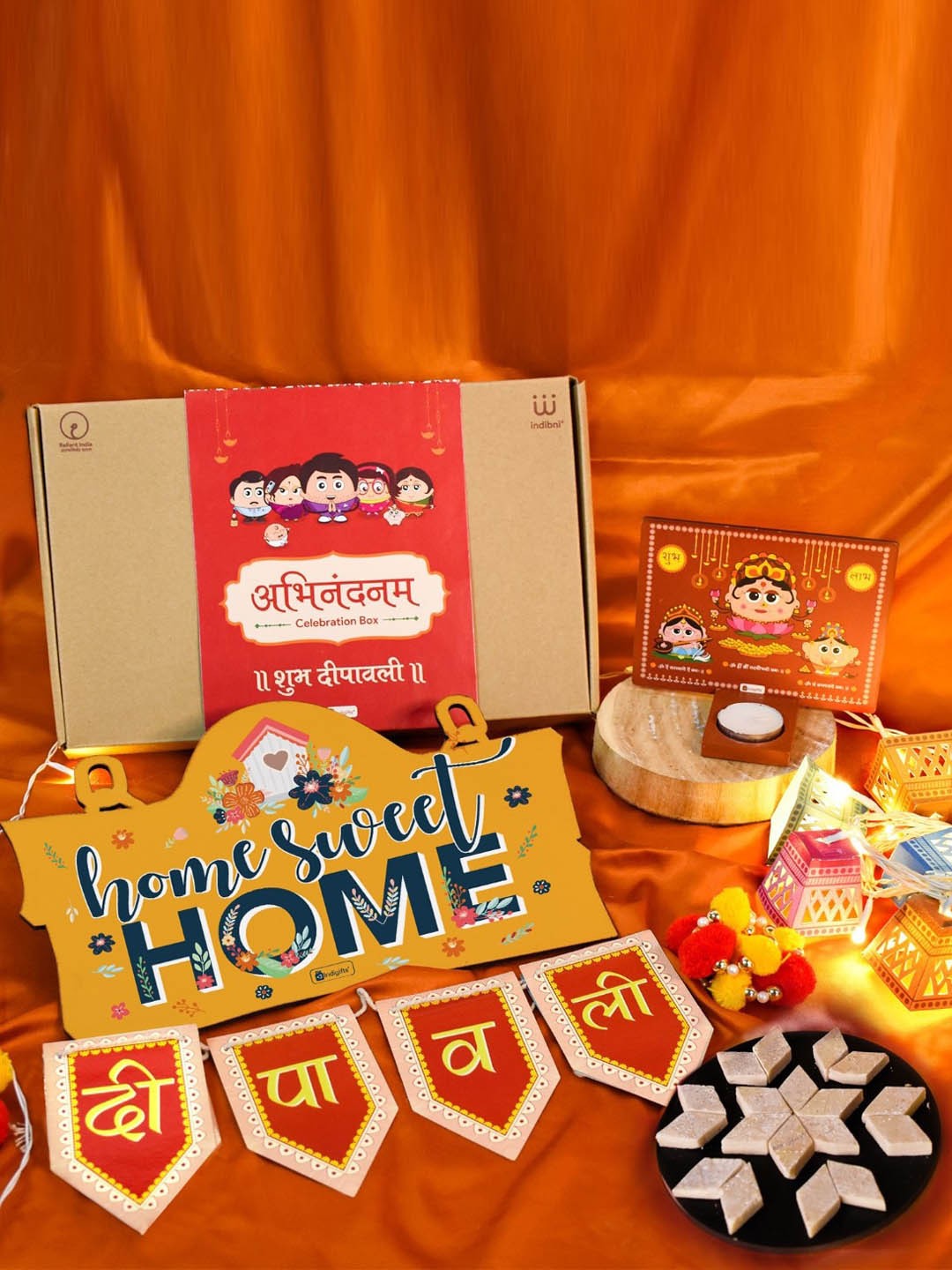 

Indigifts Yellow Printed Wooden Wall Hanging With Diwali Lights & Kaju Katli