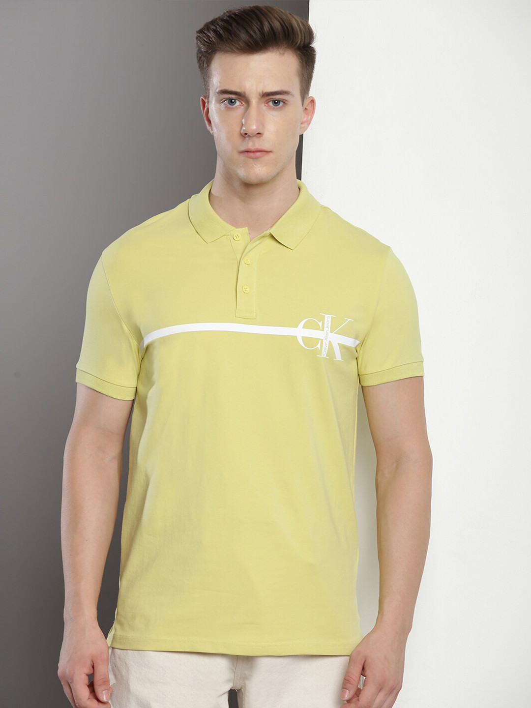 

Calvin Klein Typography Printed Polo Collar Cotton Slim Fit T-shirt, Yellow