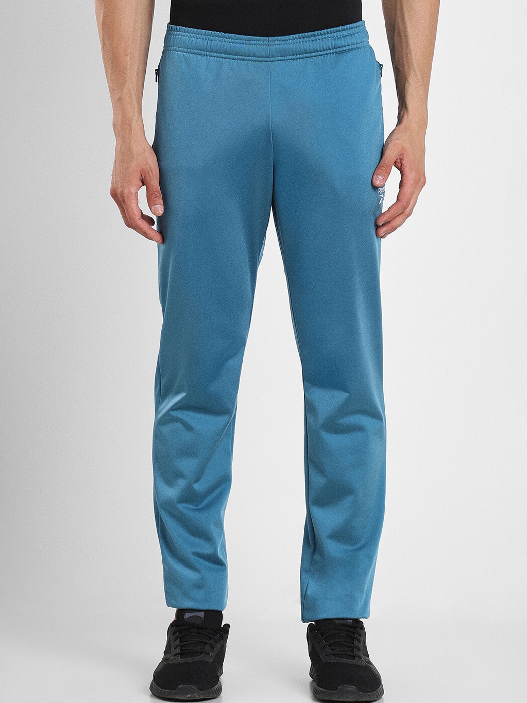 

Reebok Men Slim-Fit Mid-Rise Speedwick Sports Track Pants, Blue