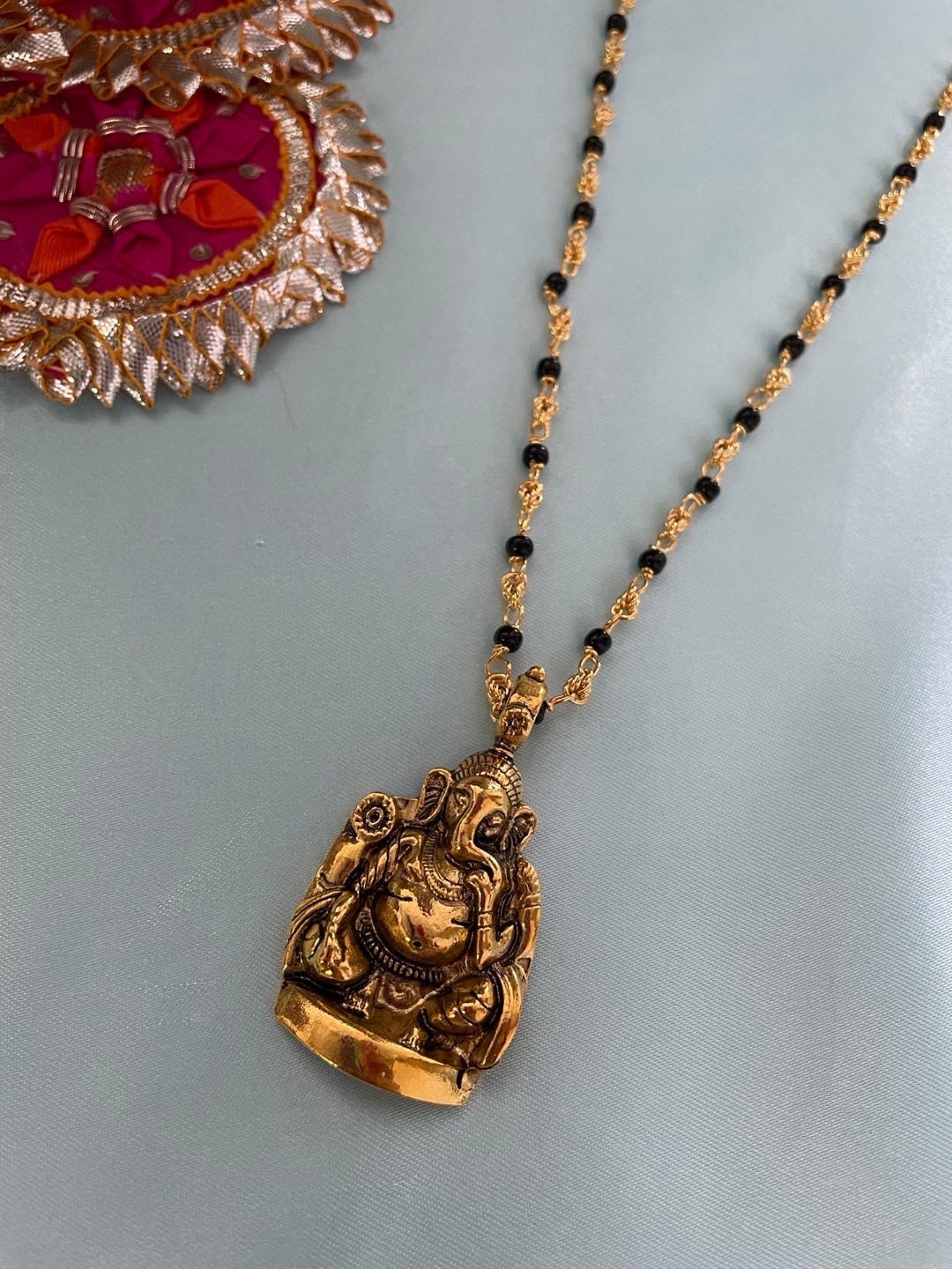

Digital Dress Room Gold Plated Lord Ganesha Pendant & Beaded Mangalsutra