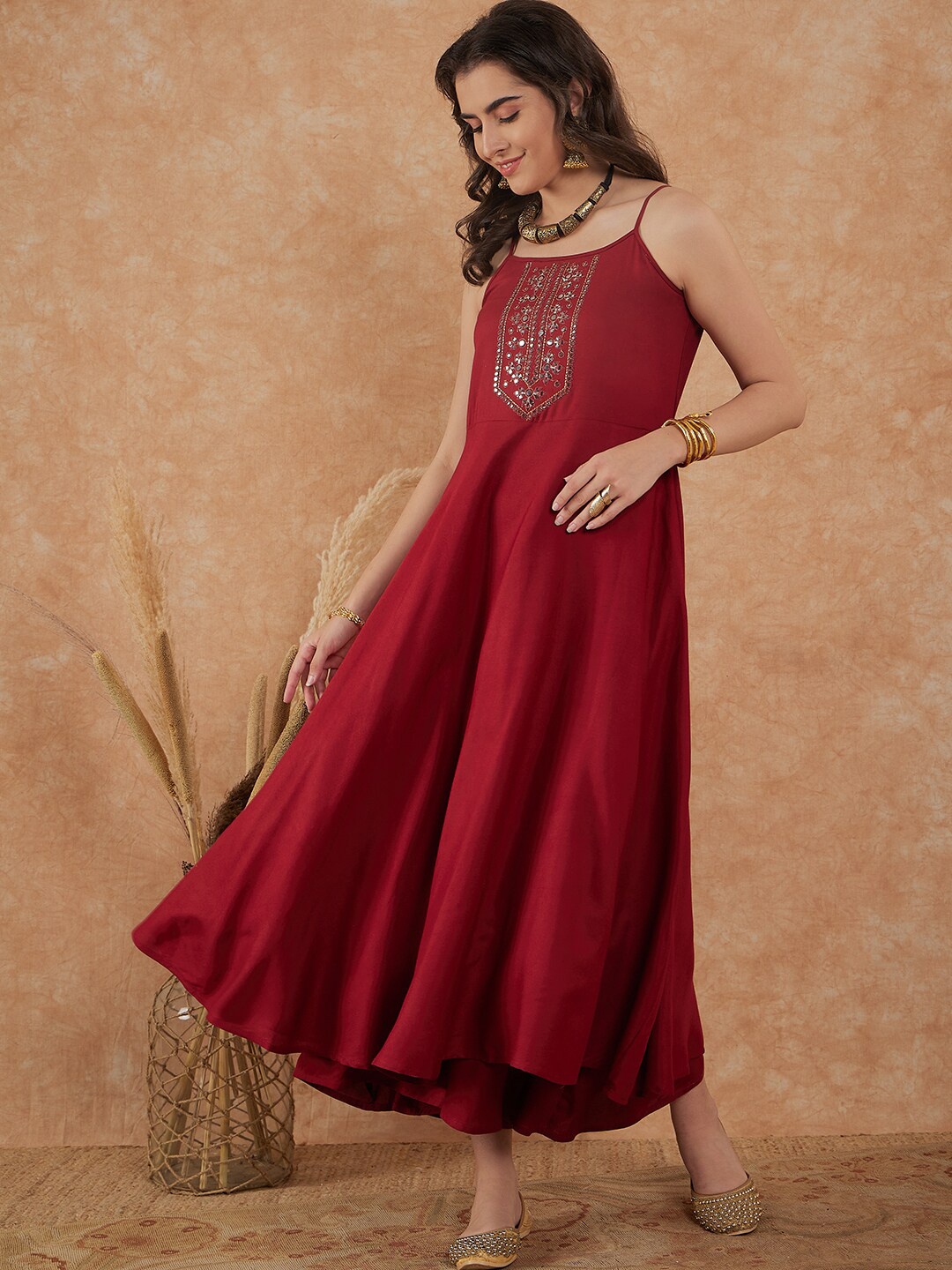 

Sangria Maroon Geometric Yoke Design Shoulder Straps Mirror Work A-Line Kurta With Palazzo