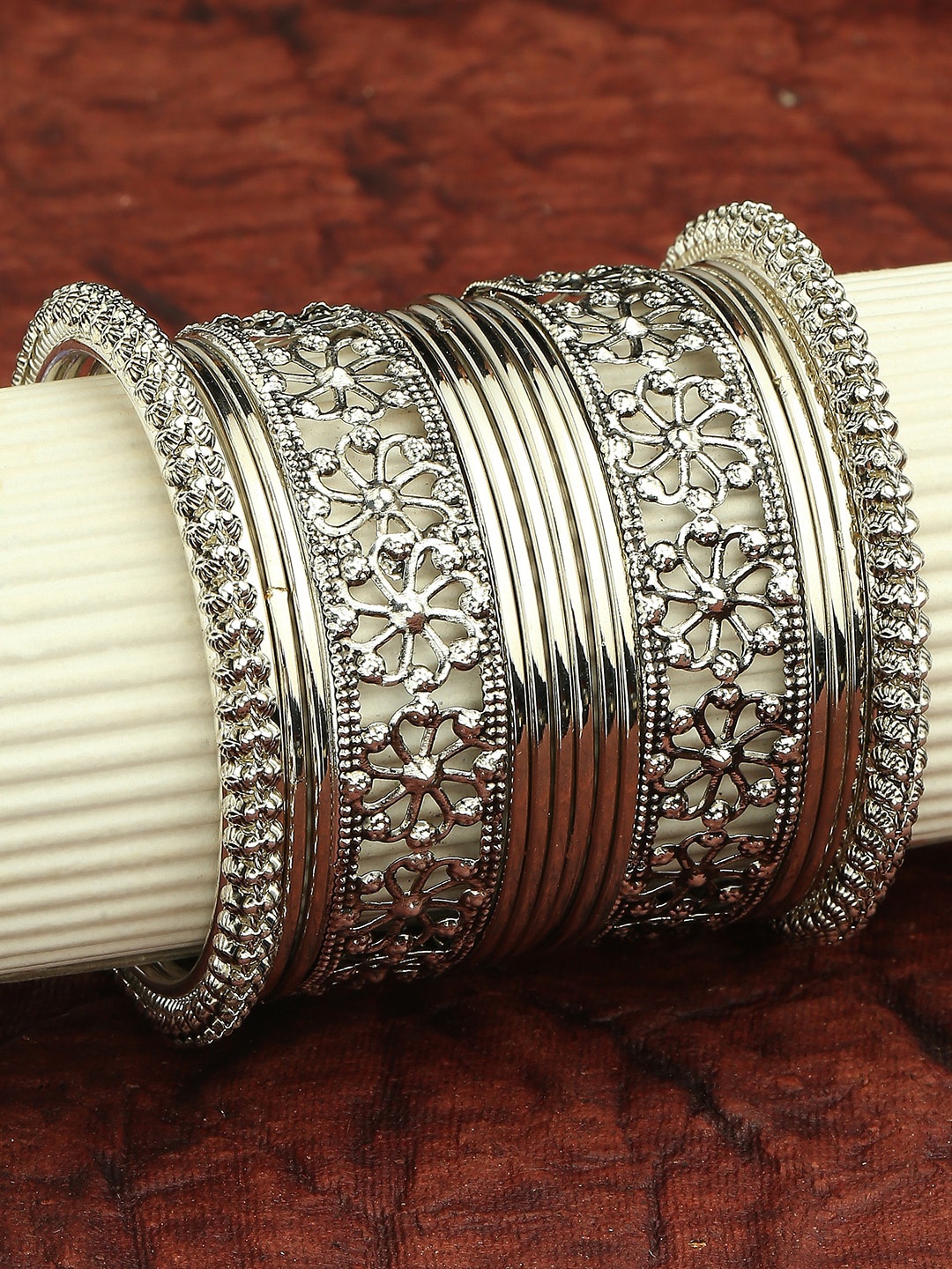 

OOMPH Set Of 16 Oxidised Floral Design Bangles, Silver