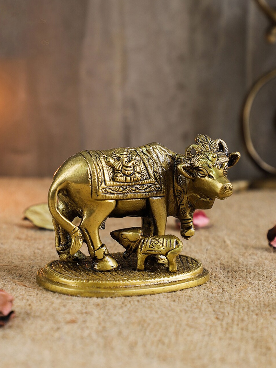 

Two Moustaches Gold-Toned Holy Kamdhenu Cow & Calf Sculpture Showpiece