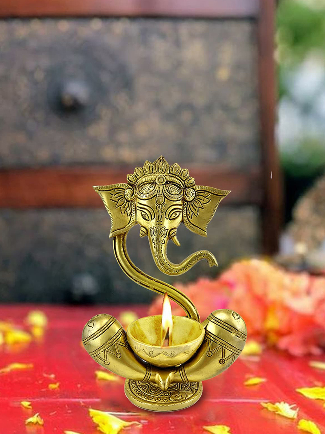 

Two Moustaches Gold-Toned Ganesha With Diya on Lap Brass Showpiece