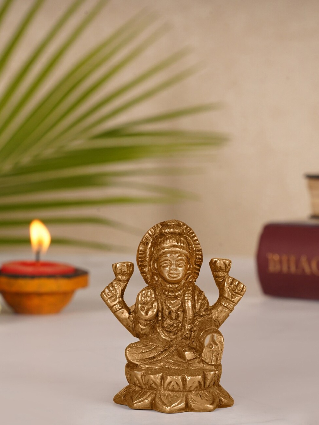 

ecofynd Gold-Toned Textured Goddess Lakshmi Idol Showpiece