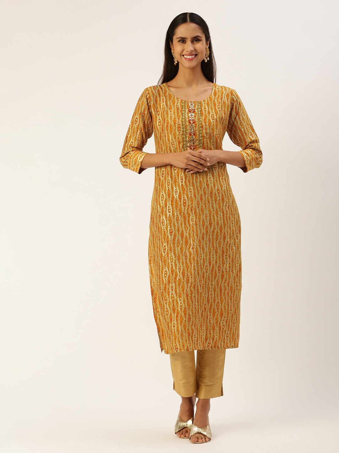 

SHANVIKA Women Printed Mirror Work Kurta, Mustard