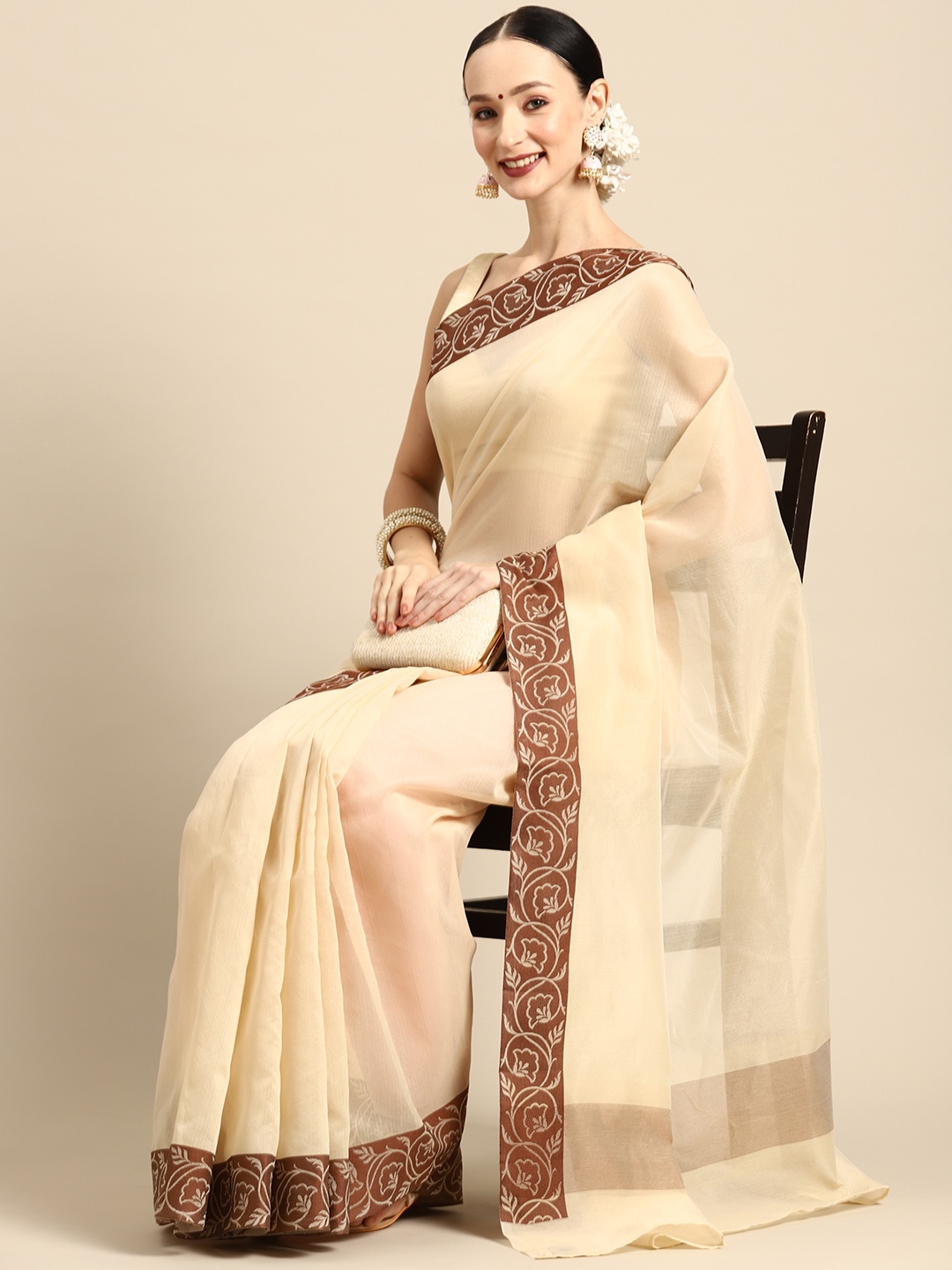 

Simaaya Solid Woven Design Saree, Cream