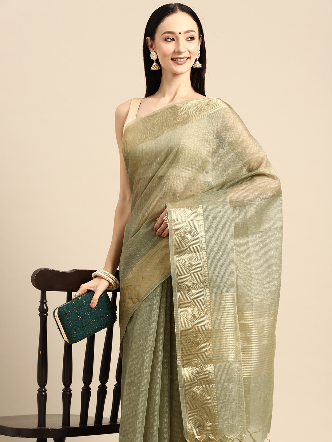 

Simaaya Solid Woven Design Zari Saree, Green