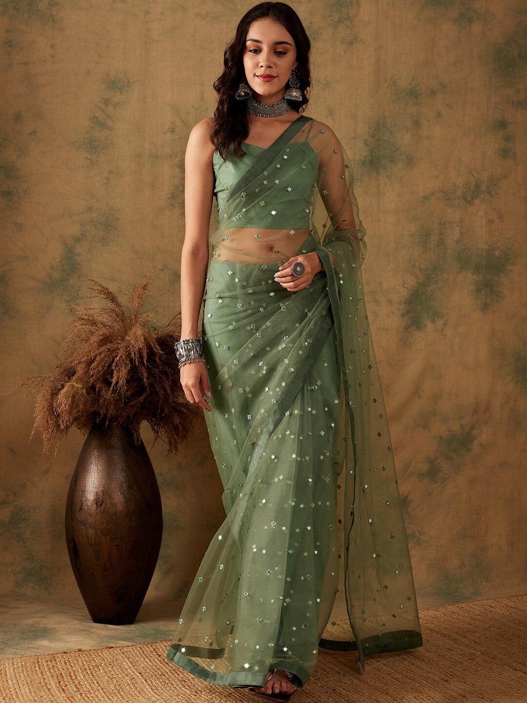 

Sangria Green Sequin Embroidered Net Saree