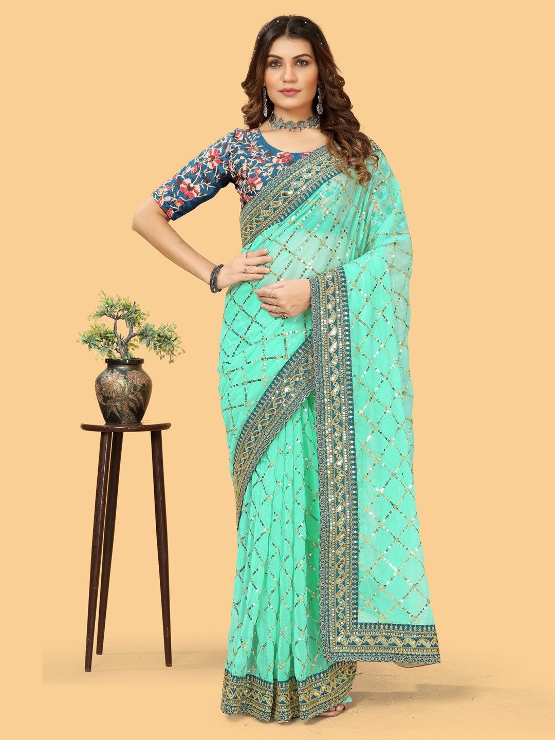 

Sangria Turquoise Blue & Gold-Toned Embellished Beads and Stones Pure Georgette Bagh Saree