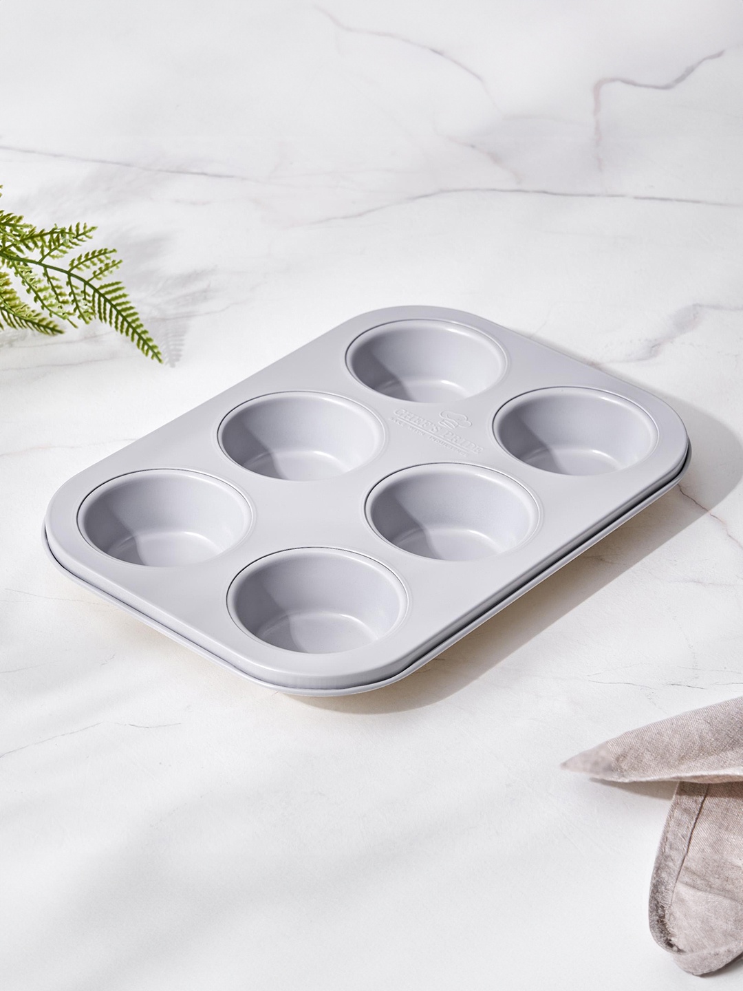 

Home Centre Grey Chefs Pride Carbon Steel Microwave Safe 6-Cup Muffin Baking Mould