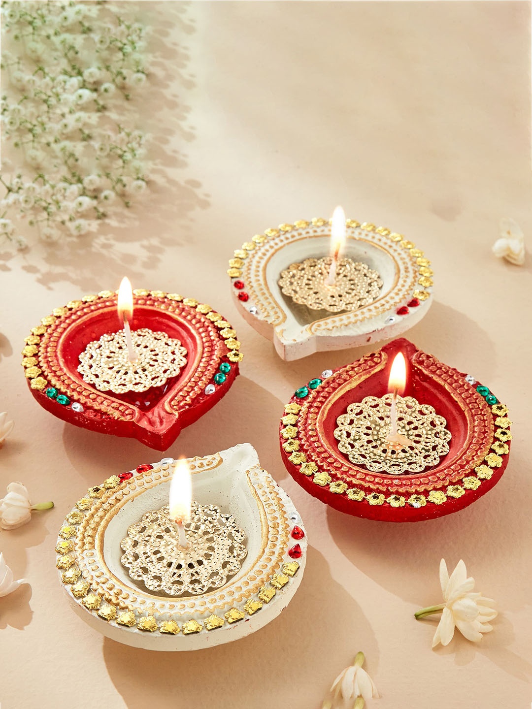 

Home Centre Red 4 Pieces Earthen Clay Drop Diyas with Jaali