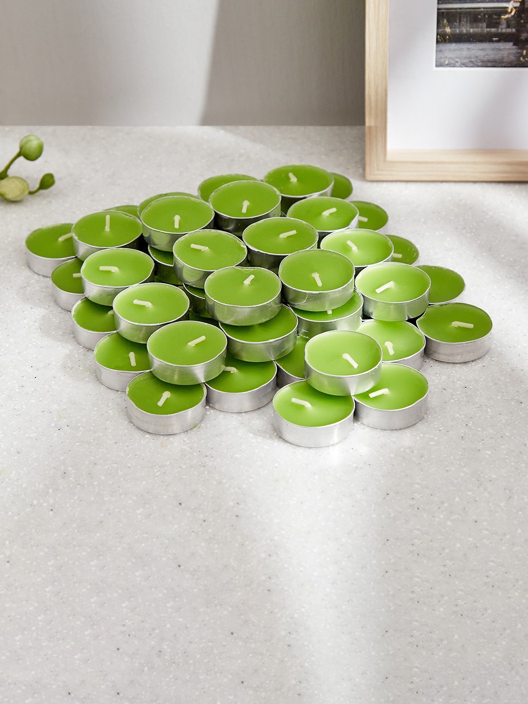 

Home Centre Green 50 Pieces Jasmine Scented T-Light Candles