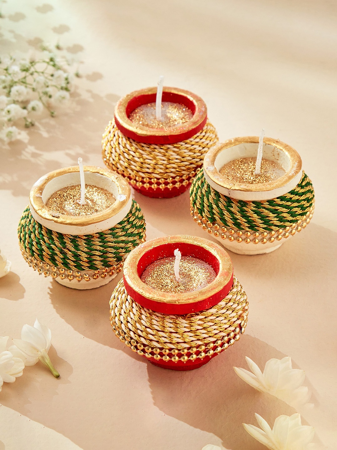 

Home Centre White & Green 4 Pieces Earthen Clay Thread Matki Diya Candles