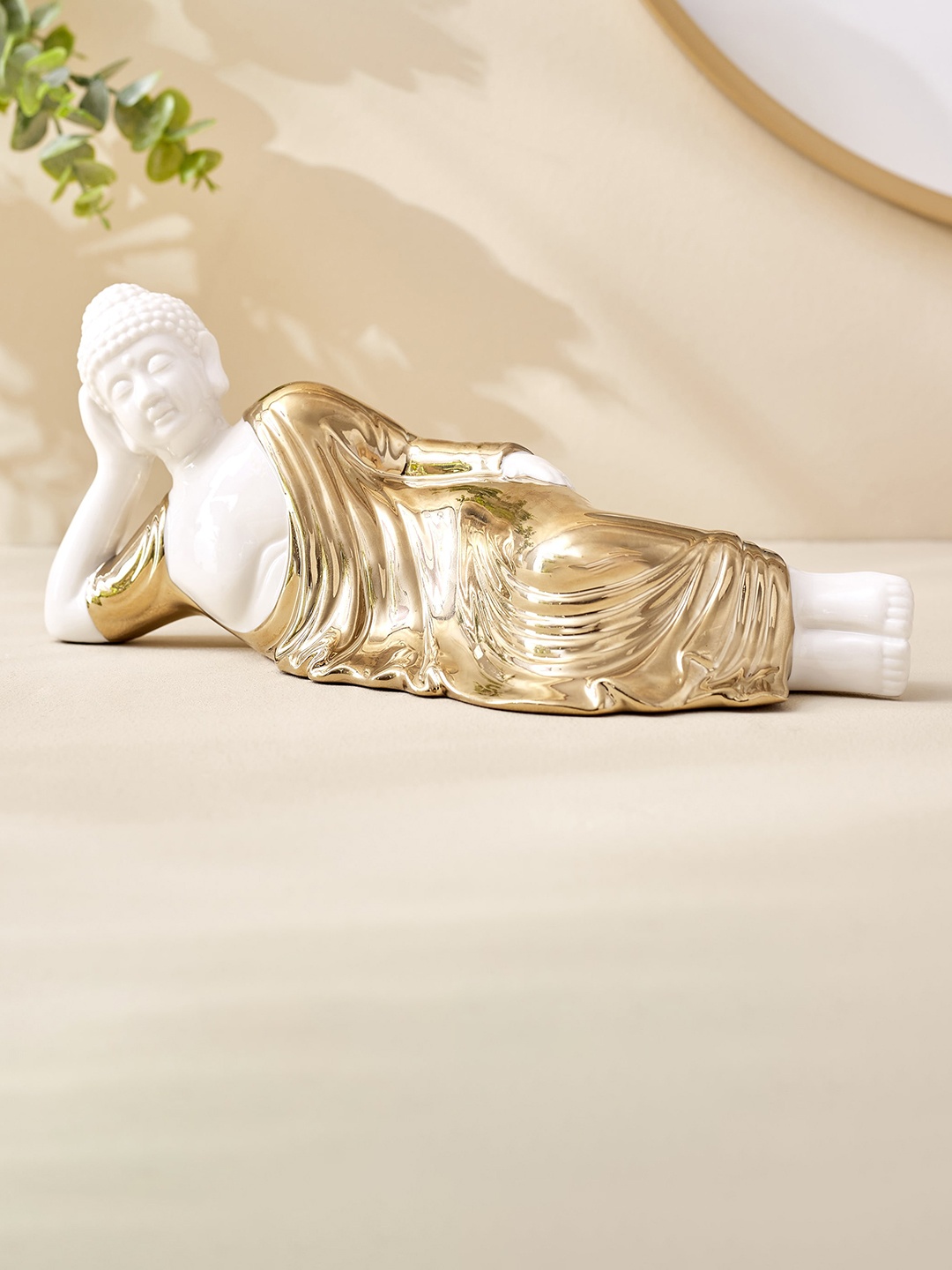 

Home Centre Noor White & Golden Ceramic Sleeping Buddha Showpiece