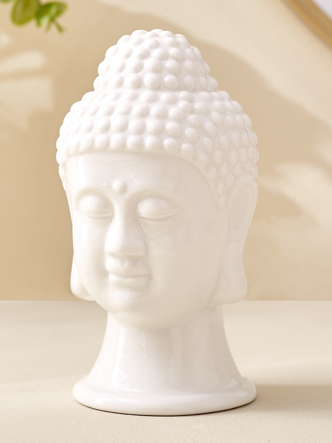 

Home Centre White Ceramic Buddha Head Showpiece